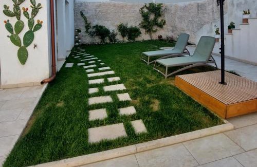 Specchia Apartment | Welcoming Sykelià - Guest House with Family-Friendly Amenities