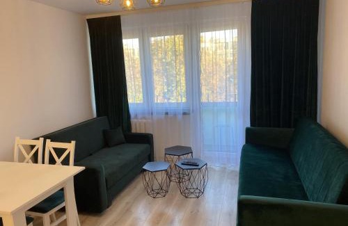 Glogow Apartment | Discover Szmaragdowy Zakątek: Family-Friendly Getaway