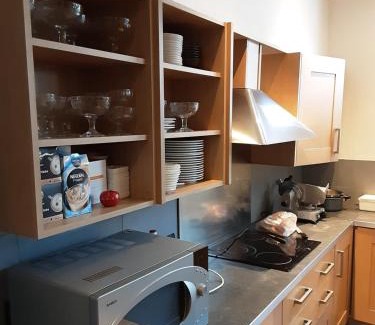 Steenhuize-Wijnhuize Apartment | Relaxing Experience at ’t Wielerpension with Pool & Dining