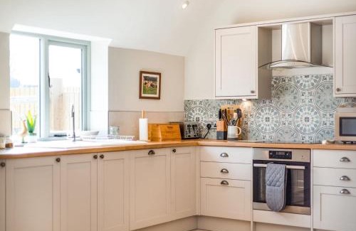 Tilston House | Family-Friendly Escape at Tadpole Mews with Hot Tub