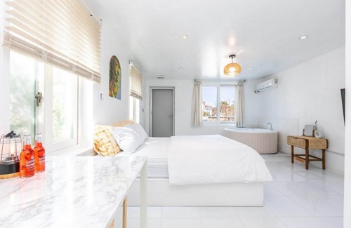 Taean House | Relax at Taean Piano Spa Pension with Pool & Hot Tub Access