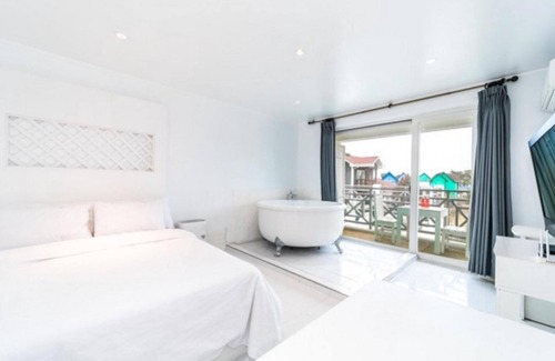Taean House | Relax at Taean Piano Spa Pension with Pool & Hot Tub Access