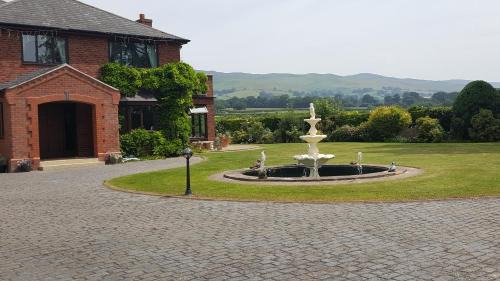 Llandyrnog House | Relax at Tall Trees: Oceanfront Haven with Pool Access