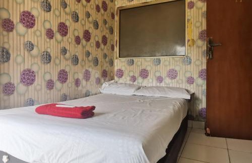 Old Jakarta Hotel | Comfortable Tangki Residence 1 RedPartner for Families