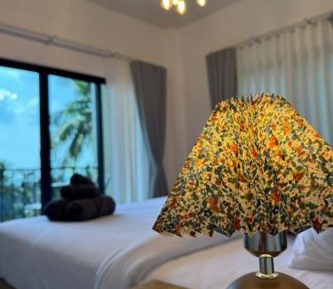 Baan Tai House | Relax at Tanouy Garden: Oceanfront Pool & Family-Friendly