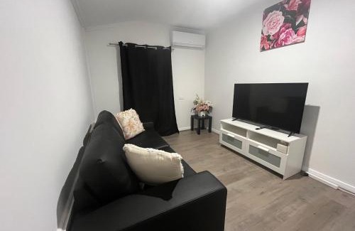 Greenacres Apartment | Cozy Tasha's Duplex on Muller with Hot Tub & Family Fun