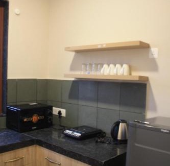 Undri Apartment | Cozy Tattva Presidential 1 BHK - Family-Friendly Retreat