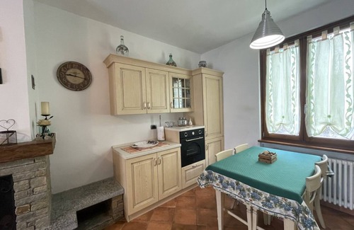 Dongo Apartment | Inviting Terraced House with Garden in Dongo - Larihome