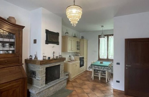 Dongo Apartment | Inviting Terraced House with Garden in Dongo - Larihome