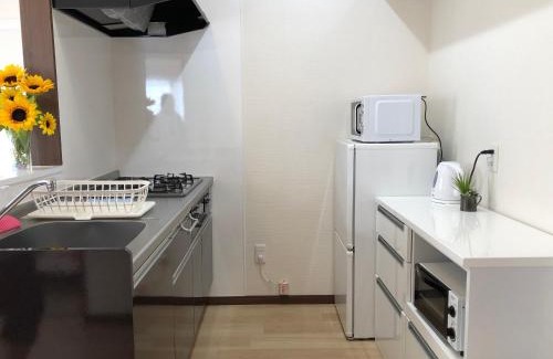 Tomigusuku Apartment | Child-Friendly Getaway at TerraceRin YN23 - Guest Rated 9.8