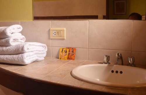 Coronel Moldes Hotel | Relax at Terrazas Del Lago: Poolside Oceanfront Retreat