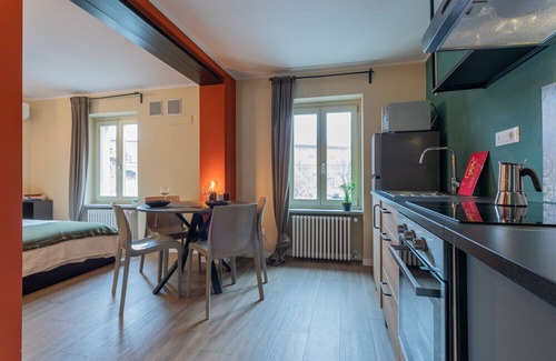 Borgo Dora Apartment | Relax at Terrazza Borgo Dora with Family-Friendly Amenities