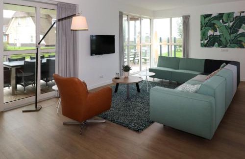 Delfstrahuizen Villa | Tranquil Thatched Villa by the Water with Family Amenities