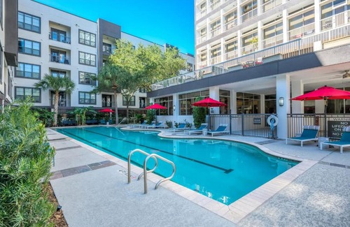 Houston Apartment | Aliyah Poolside Retreat with Ocean Views, Gym & Theater