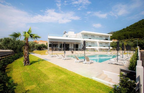 Skala Rachoniou Apartment | Exclusive Oceanfront Stay at The Angeliki Boutique Hotel