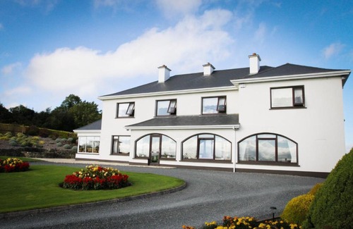 Drumyouth House | Discover The Arches Farmhouse B&B: 4-Star Retreat with Pool