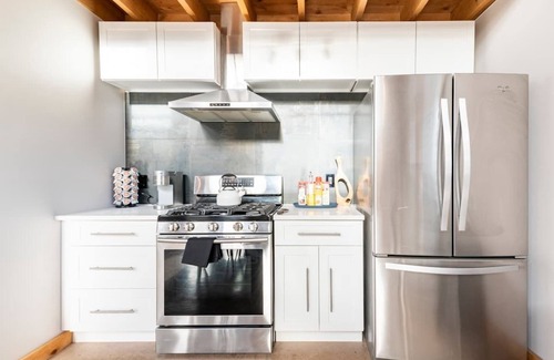 Caroline House | Experience The Barn: Cozy Chalet with Hot Tub & Campfire