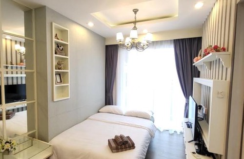 Saen Suk Apartment | Relax at The Blu X Seaview: Family-Friendly Pool Retreat