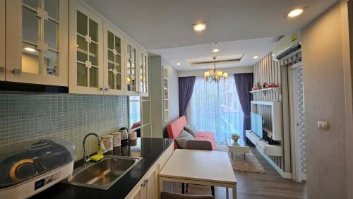 Saen Suk Apartment | Relax at The Blu X Seaview: Family-Friendly Pool Retreat