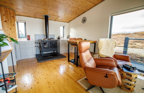 Tomich Cabin | Idyllic Boathouse: Lochside Bothy with Pool & Spa Access