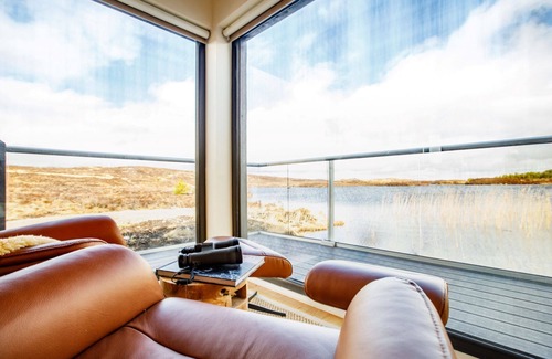 Tomich Cabin | Idyllic Boathouse: Lochside Bothy with Pool & Spa Access