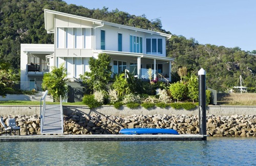 Nelly Bay House | Experience The Boathouse: Oceanfront Holiday Home Awaits
