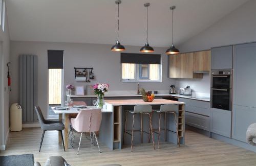 Otterburn House | Experience The Bunker: Pet-Friendly Retreat with Spa Amenities