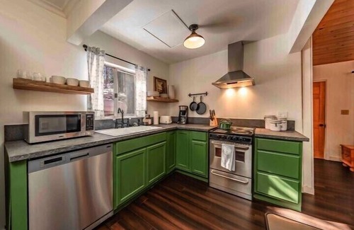 West Village Cabin | Experience The Cedar House: Walk to Town with Cozy Fireplace