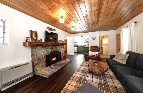 West Village Cabin | Experience The Cedar House: Walk to Town with Cozy Fireplace