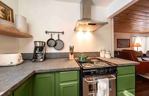 West Village Cabin | Experience The Cedar House: Walk to Town with Cozy Fireplace