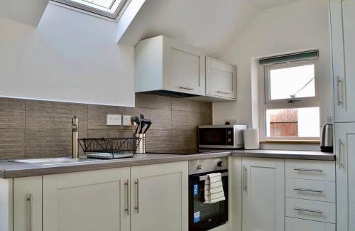 Strathcarron House | Experience The Coolins Cottage with Cozy Wood Burner
