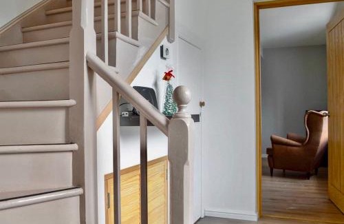 Strathcarron House | Experience The Coolins Cottage with Cozy Wood Burner