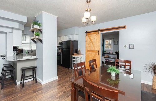 Des Moines House | The Cow Tipper: Family-Friendly Getaway with Spa & Game Room
