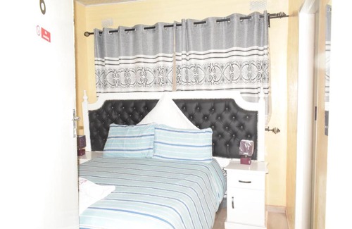 Harare House | Cozy Crown Inn Guest House with Oceanfront Amenities