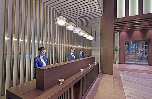 Diplomatic Area Hotel | Elegant Stay at The Curve Hotel with Pool & Kitchen Amenities