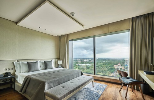 Thigalarapalya Hotel | Elegant The Den Bengaluru: 5-Star Stay with Spa & Pool
