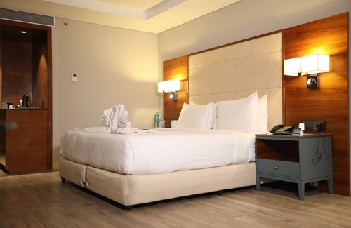 Kolar Hotel | Discover The Elite Narasapura with Pool and Family Amenities
