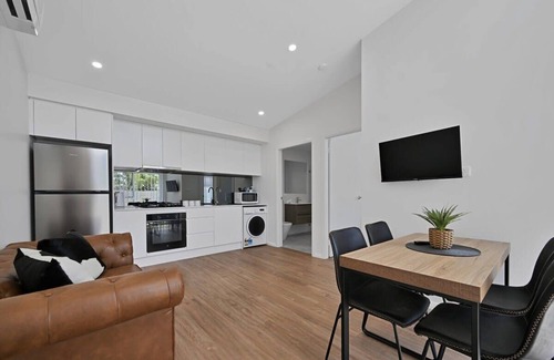 Orange Apartment | Discover The Elm Apartments: Family-Friendly Cowhide Room