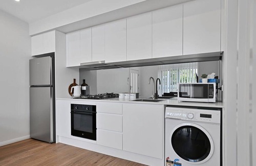 Orange Apartment | Discover The Elm Apartments: Family-Friendly Cowhide Room