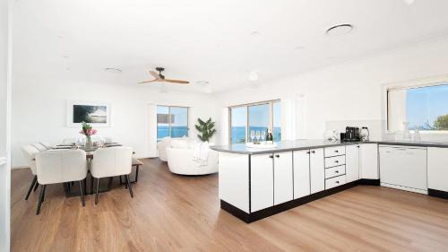 Salamander Bay House | Ideal Family Retreat with Breathtaking Water Views
