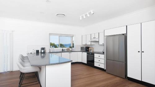 Salamander Bay House | Ideal Family Retreat with Breathtaking Water Views