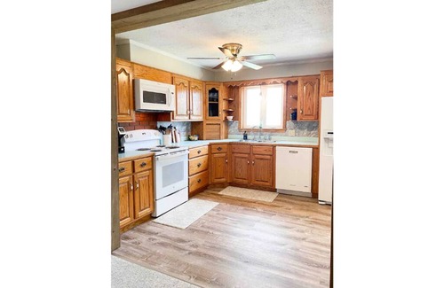 Harrisonville House | Experience The Farmhouse at Pleasant Ridge with Hot Tub & Spa