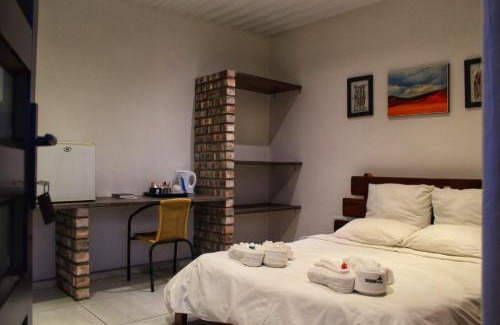 Outjo House | Cozy Farmhouse Boutique Guesthouse with Pool & Beergarden