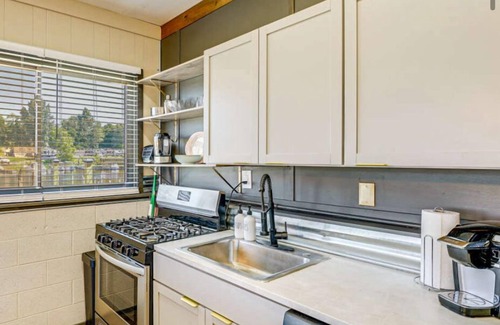 Ludington Apartment | The Goldfish is waterfront on PM Lake, Boat Docks, Fire Pit, 1 mile to downtown
