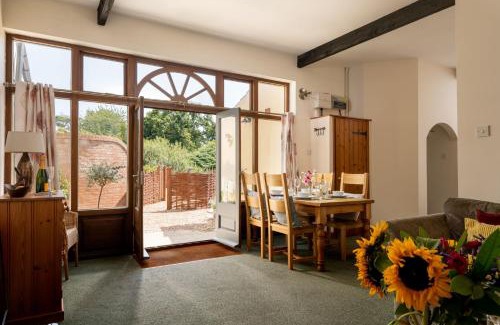 Tunstead House | Discover The Granary: Pet-Friendly Retreat with Pool Access