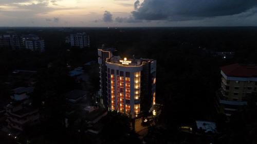 Kuppaayil Hotel | Discover The Habitat Suites: Family-Friendly with Pool