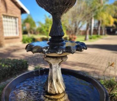Newcastle House | Relaxing Hills Guest House: 4-Star Retreat with Pool & Breakfast