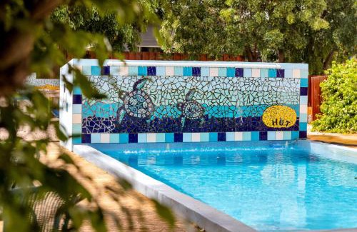 Playa Hotel | Eco-Friendly Oasis at The Hut Bonaire with Oceanfront Views