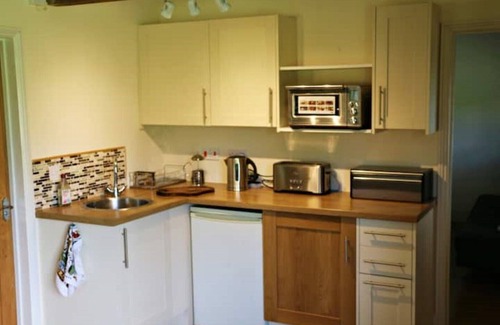 East Harling Cottage | Relaxing Retreat at The Lodge with Hot Tub & Private Garden