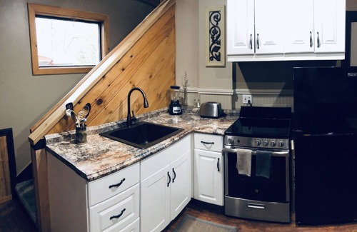 Weaverville House | Historic Carriage House Loft King Room with Full Kitchen